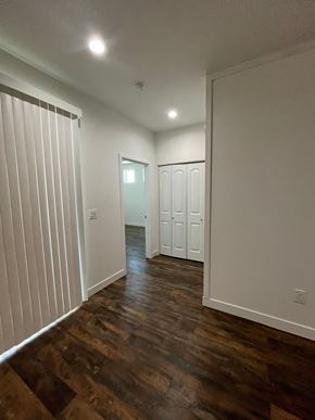 Phoenix apartment for rent - a living room with white walls and wood floors