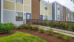 Capitol Heights townhouse for rent - an apartment building with a garden in front of it