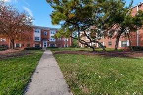 Seat Pleasant apartment for rent - a sidewalk in front of a brick building