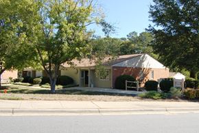Gastonia apartment for rent - a small yellow house on the side of the street