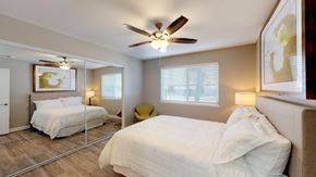 El Cajon apartment for rent - a bedroom with two beds and a ceiling fan
