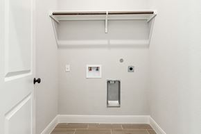 Hondo house for rent - the living room of a home with a white wall and a white door