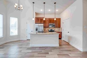 Spring Branch apartment for rent - an empty kitchen with a large island in the middle