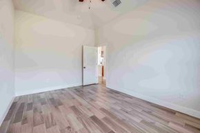 Spring Branch apartment for rent - a living room with white walls and wood floors