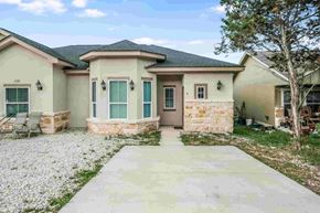 Spring Branch apartment for rent - a house with a concrete walkway in front of it
