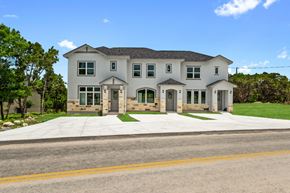 Spring Branch apartment for rent - a large white house with a street in front of it