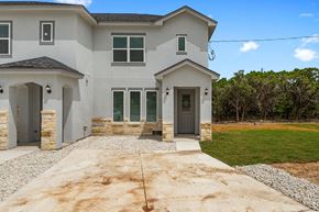 Spring Branch apartment for rent - a new house with a driveway and a lawn