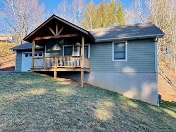 Boone house for rent - a blue house with a deck on the side of it