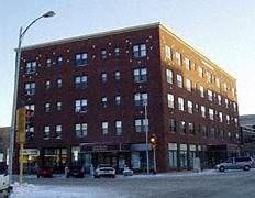 Fargo apartment for rent - a large brick building on the corner of a street