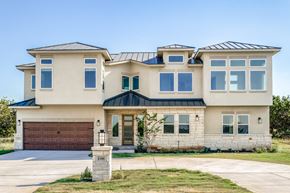 Horseshoe Bay house for rent - a beige house with a garage and a driveway