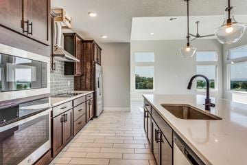 Horseshoe Bay house for rent - a large kitchen with wooden cabinets and a sink