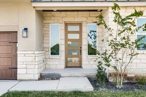Horseshoe Bay house for rent - the front of a building with a brown door and windows