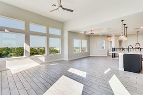 Horseshoe Bay house for rent - a large living room with large windows and a ceiling fan