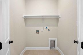 Hondo house for rent - the entrance to a room with a white wall and a door
