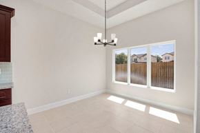 Hondo house for rent - a living room with a window and a chandelier