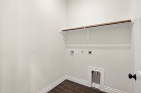 Hondo house for rent - the living room of a home with a white wall and a door to the closet
