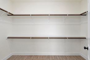 Hondo house for rent - an empty closet with white walls and a wood floor
