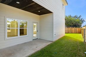 Hondo house for rent - the entrance to a home with a patio and grass