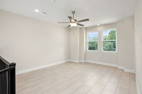 Spring Branch apartment for rent - an empty living room with a ceiling fan and a window