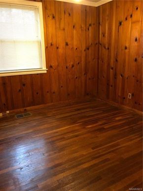 Montgomery house for rent - an empty room with wood floors and a window