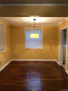 Montgomery house for rent - a empty room with yellow walls and a window