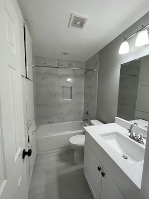 Killeen house for rent - A white bathroom with a marble wall.