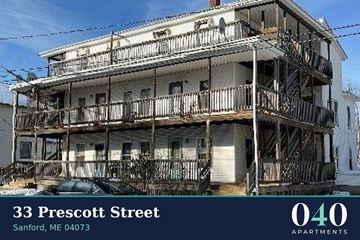 Sanford apartment for rent - A large white building with balconies is located at 33 Prescott Street in Sanford, ME 04073.