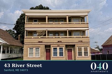 Sanford apartment for rent - A two story apartment building with the number 43 on it.