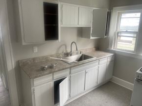 Akron apartment for rent - A kitchen with a sink and cabinets.