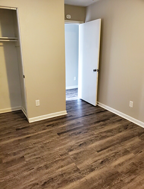 Little Rock apartment for rent - a living room with wood flooring and an open door