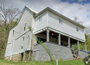 Fairmont apartment for rent - an old house with its roof torn off