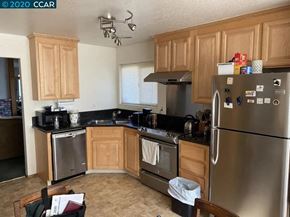 Bay Point apartment for rent - a kitchen with stainless steel appliances and wooden cabinets