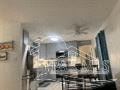 Gulf Breeze house for rent - a kitchen with a counter and a window