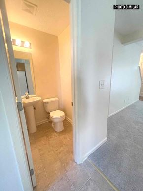 Winchester townhouse for rent - a bathroom with a toilet and a sink and a mirror