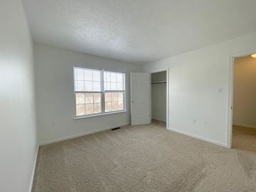 Winchester townhouse for rent - the living room of an apartment with carpet and a window
