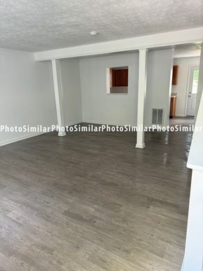 Winchester townhouse for rent - a living room with white walls and a wood floor