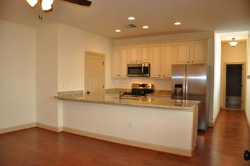 Winchester apartment for rent - a kitchen with a granite counter top and a stainless steel refrigerator