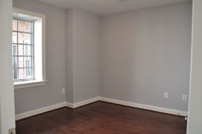 Winchester apartment for rent - an empty room with wooden floors and a window