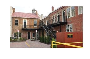 Winchester apartment for rent - the entrance to a brick building with a staircase