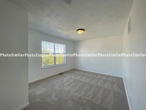 Winchester townhouse for rent - A room with a carpeted floor and a window letting in natural light.