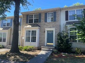 Winchester townhouse for rent - the front of a brick house with a blue door