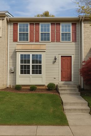 Winchester townhouse for rent - A house with a red door and a window with red shutters.