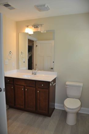 Winchester apartment for rent - A white toilet sits next to a sink in a bathroom.