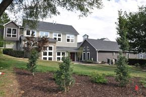 Winchester apartment for rent - a view of a house with a lawn and trees