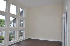 Winchester apartment for rent - an empty living room with large windows and a wooden floor