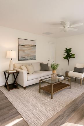 Winchester townhouse for rent - A living room with a white couch, a coffee table, and a ceiling fan.