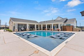 Denton apartment for rent - a swimming pool with leasing office in the background