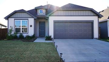 Royse City house for rent - a garage door in front of a house