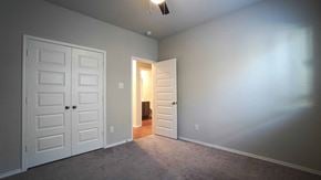Royse City house for rent - a bedroom with a closet and an open door