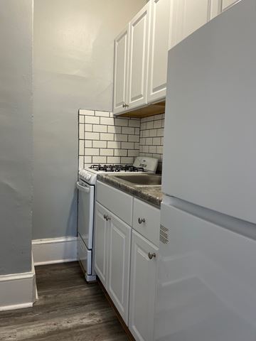 Poughkeepsie apartment for rent - A white kitchen with a dishwasher and a washing machine.